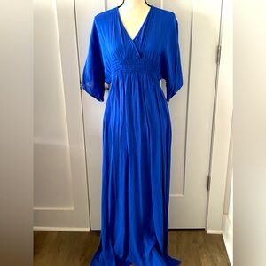Royal blue flowing maxi dress. V-neck front and back. Side slits. Size S